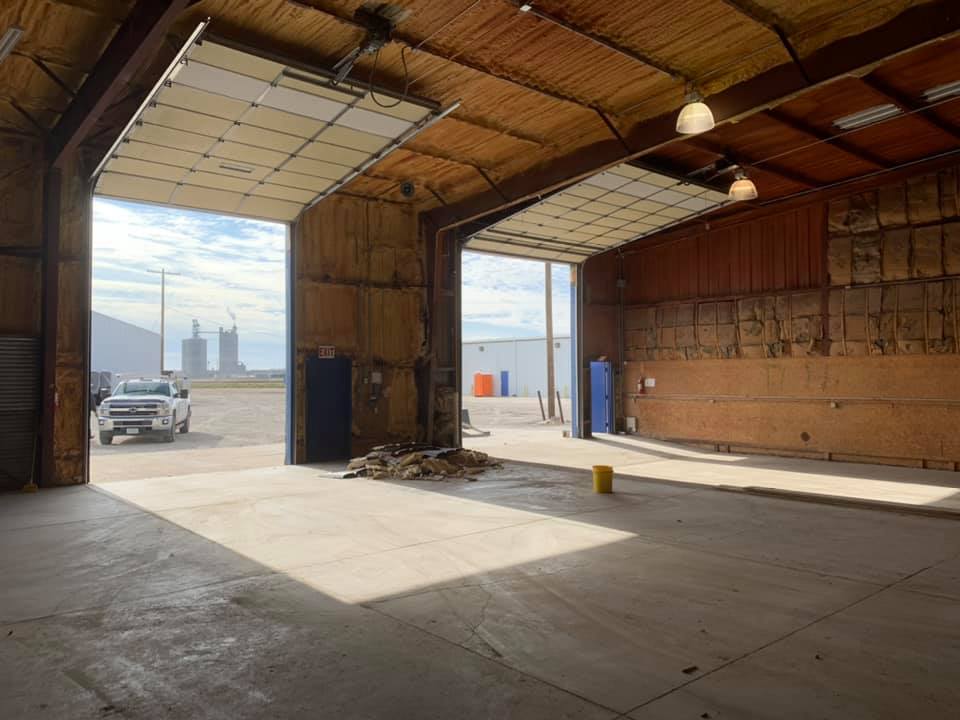 big empty garages with two large open garage doors